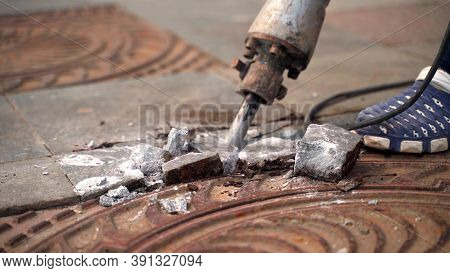 Working With A Jackhammer On The Slab. Legs Of A Worker With A Jackhammer Smashing A Marble Slab. 4k