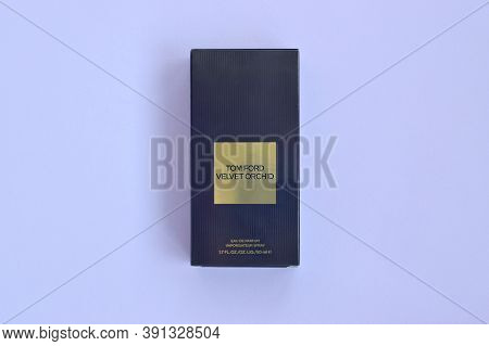 Tom Ford Velvet Orchid Fragrance Perfume Bottle Lies On Light Lilac Background. Tom Ford Is American