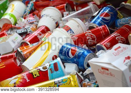 Many Wrappings And Cans From Used Products By Famous Worldwide Brands. Pattern Of Trash Of Various C