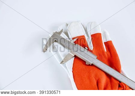 Measuring Inner Diameter, Outer Diameter, Length With A Caliper On A White Background.