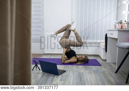 Fitness Yoga coaching working from home - Personal training online stock photo