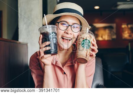 Chiang Mai, Thailand : 22/07/2020 : Tourist Woman Holding A Cup Of Choco-choco Nutty Frappuccino Wit