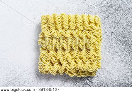 Dry, Raw Quick Cooking Noodle, Instant Noodles. White Background. Top View