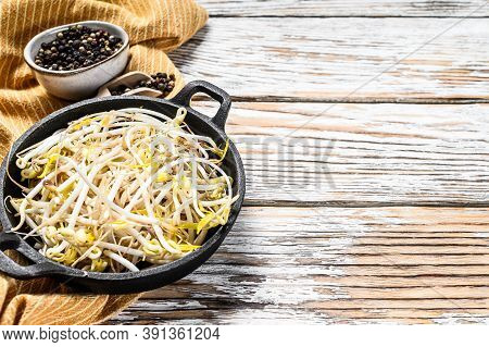 Raw White Organic Bean Sprouts In A Bowl. White Background. Top View. Copy Space