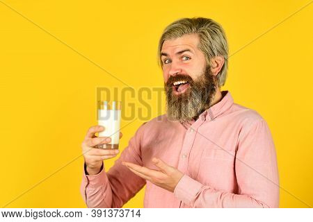 Fermented Foods Healthy Eating Concept. Happy Farmer Present Milk Glass. Bearded Man Drink Useful Mi