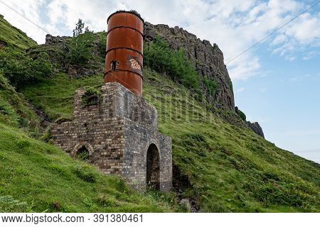 The Ruins Of Old Diatomite Factory And Rusty Chimney In Isle Of Skye, Scotland, Uk