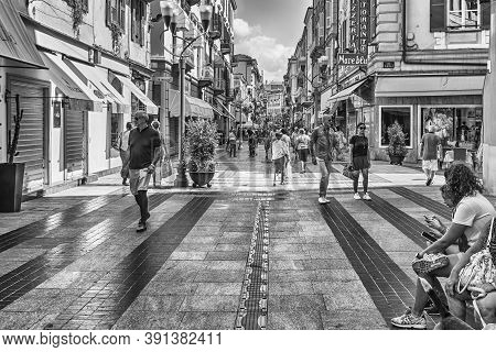 Sanremo, Italy - August 18: Walking In The Centre Of Sanremo, Italy, On August 18, 2019. The City Ho