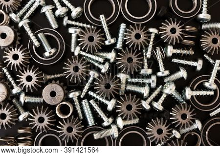 Mechanical Components On Black Background. Industrial Objects