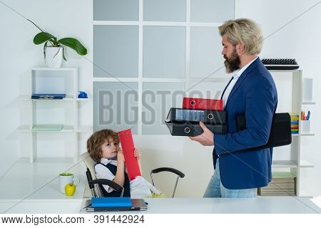 Colleagues Brainstorming In Talk. Cute Boy Kid Sitting In Office Chair Self Confident Like Big Boss,