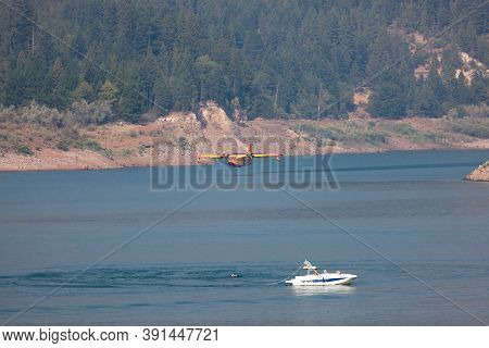 Lost Creek Lake Near Prospect,  Oregon / Usa - September 7, 2014:  A Small Fire Fighting Plane Prepa