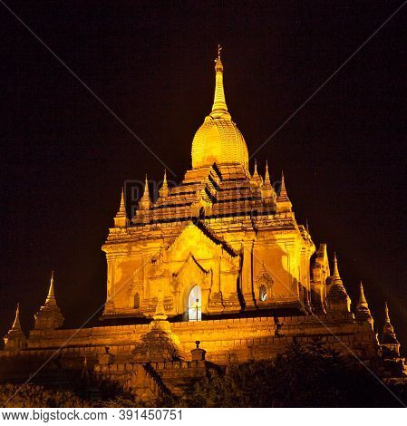 Bagan Temple In Myanmar At Night Illuminated. Buddhist Pagoda In Myanmar Litup At Night.