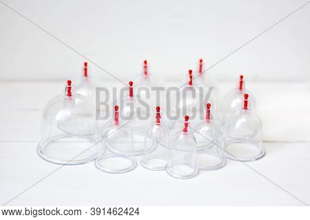 Jars For Hijama On A White Wooden Background. Bloodletting. Sunnah Treatment. Islam.