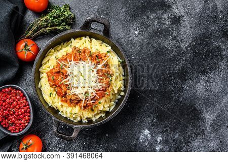 Bolognese Pasta, Risone With Ground Beef In A Plate. Black Background. Top View. Copy Space
