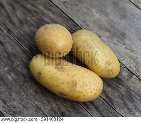 Top View Of Patato Isolated On Wooden Taber Background