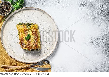 Baked Stuffed Vegetarian Pasta Cannelloni With Broccoli, Spinach, Basil And Cheese. Gray Background.