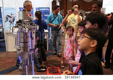 SUBANG JAYA - NOVEMBER 10: A robot performs for unidentified visitors at the World Robot Olympaid on November 10, 2012 in Subang Jaya, Malaysia. This year's theme is Robots connecting people.