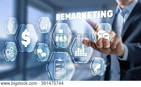 Remarketing Digital Marketing Concept. Businessman Presses Remarketing On Virtual Screen.