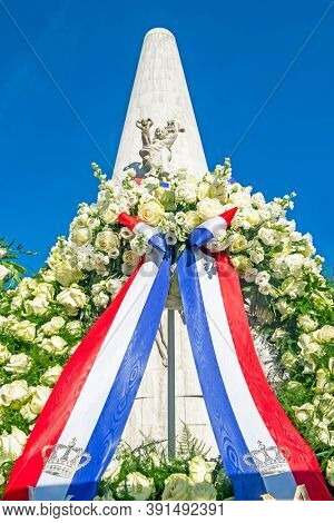 Amsterdam, Netherlands - May 6, 2020: Wreath from King Alexander and Queen Maxima at the Monument on the Dam in Amsterdam Netherlands on occasion of remembrance of the worldwar II