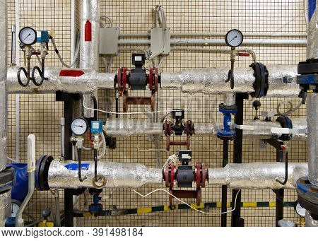 Modern Independent Heating System In Boiler Room. Pipelines, Water Pump, Valves, Manometers. Heating