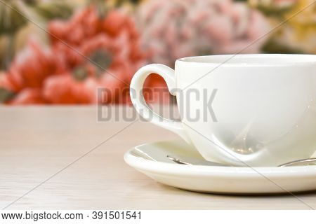 White Cup With Tea Or Coffee On The Background Of A Cozy Interior In A Restaurant. Fresh Drink On A 