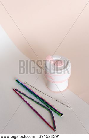 Silicone Straw Cup With Stainless Steel Straws In Ligtht Background.