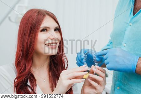 Doctor Orthodontist Recommends A Girl Silicone Aligners To Straighten Teeth