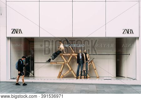 Madrid, Spain - 3rd October, 2020: Shop Window Of Zara Fashion Store On Preciados Street. Young Man 