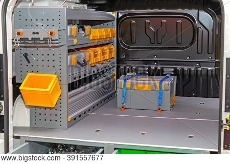 Transport Box Load Secured With Ratchet Straps In Mobile Workshop Van
