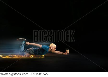 Speed. Fast Delivery Service - Deliveryman On Skateboard Driving With Order In Fire On Dark Backgrou