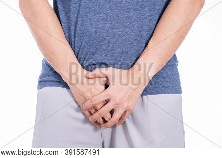 Man Hands Holding His Crotch Isolated White Background. Medical, Healthcare For Advertising Concept.
