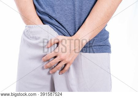 Man Hands Holding His Crotch Isolated White Background. Medical, Healthcare For Advertising Concept.