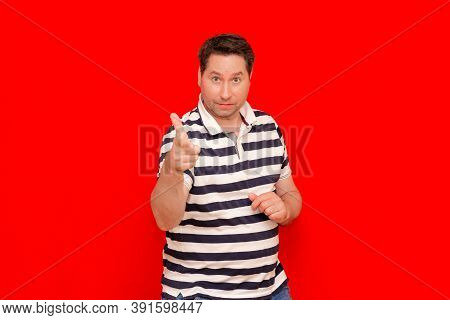 35s Man Wearing Casual Striped T-shirt Standing Over Isolated Red Background Showing And Pointing Up