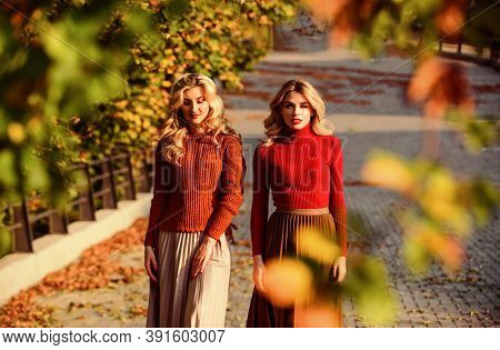 Forest Foliage. Sunny Day With Fallen Leaves. Fall Fashion Season. Pleated Trend. Girls In Corrugate
