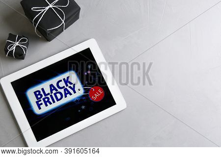 Tablet And Gift Boxes On Grey Stone Table, Space For Text. Black Friday Sale Online