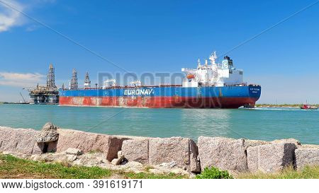 Port Aransas, Tx - 28 Feb 2020: The Cap Guillaume, A Crude Oil Tanker Sails Past Oil Rigs In Dry Doc