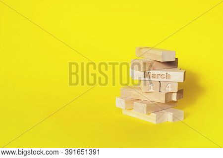 March 14th. Day 14 Of Month, Calendar Date. Wooden Blocks Folded Into The Tower With Month And Day O