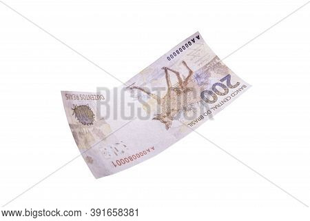 Two Hundred Reais Bill Falling On Isolated Background, New Brazilian Banknote. Wealth, Draw And Prof