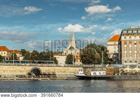 Prague,czech Republic-september 3,2020. Postcard View Of Rasin Embankment And Emauzy Monastery.river