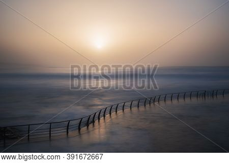 Natural Pool By The Sea You Can See The Sunset And A Railing