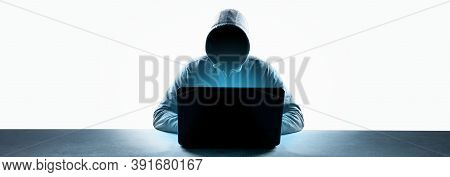 Anonymous Internet Hacker In Front Of Computer. Web Crime Concept