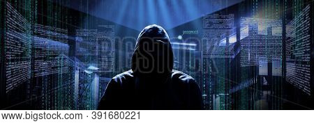 Anonymous Internet Hacker In Front Of Computer. Web Crime Concept