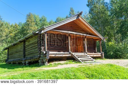 Old Wooden Building In The Forest. Russian Barn. Ancient, Wooden Architecture.