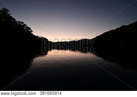 Autumn Landscape Reflections On Lake Santeetlah, North Carolina In Twilight.