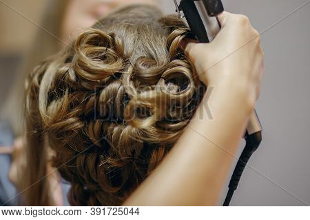 Curlers Make Curls On Women's Hair. Hairdresser Services For The Concept Of Evening And Festive Hair