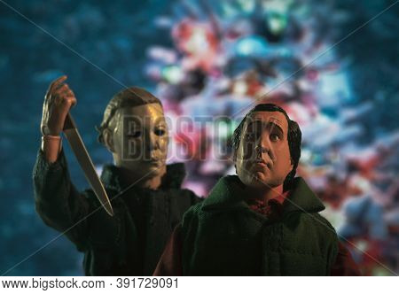 OCT 25 2020: Slasher Michael Myers of Halloween stalking Clark Griswold of National Lampoons Christmas Vacation - Neca action figure
