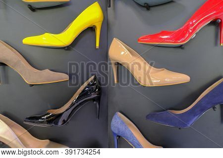Red, Yellow, Black, Brown, Blue And Beige Shoes On Heels On Store Display Close-up. Fashion Stylish 