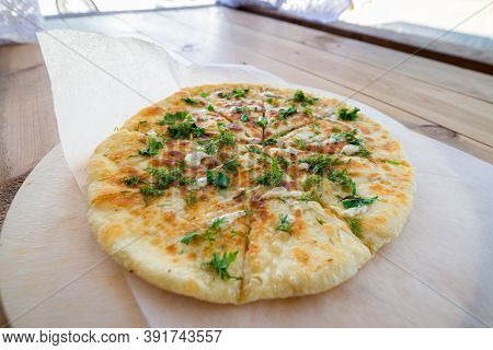 Close Up Pile Of Caucasian Khychin Bread Pie With Stuffing.
