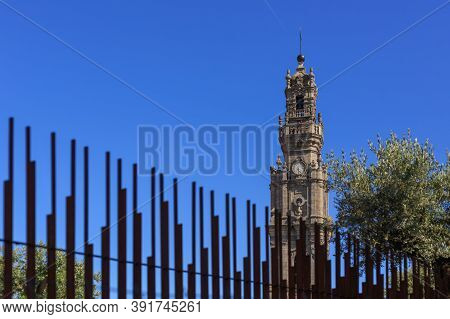 Porto, Portugal - June 01, 2013: Torre Dos Clérigos. The Iconic Clerigos Tower On A Sunny Day. A Cou