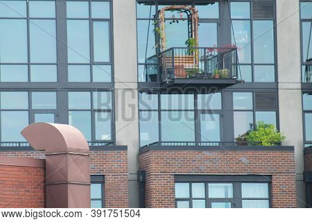 Cozy Balcony With Plants On A Modern Building