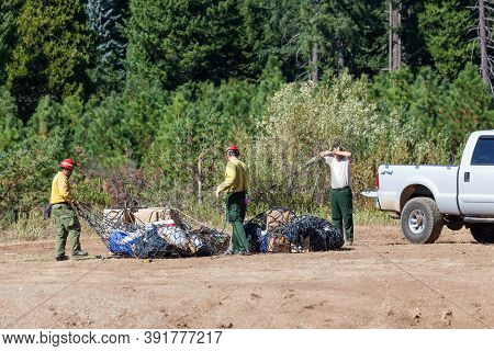 Prospect,  Oregon / Usa - September 9, 2014:  Wildfire Fighting Support Teams Receive Supplies Dropp